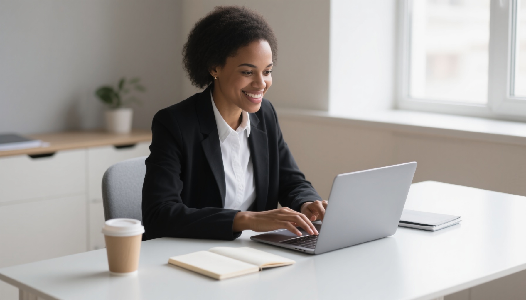 A successful professional sending a follow-up email after an interview